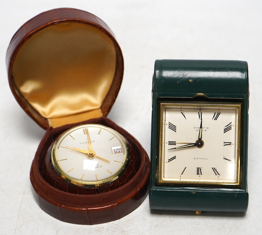 A Turler crocodile cased travelling alarm timepiece and another in green leather. Condition - green case a little scuffed, both wind and are currently ticking but not guaranteed